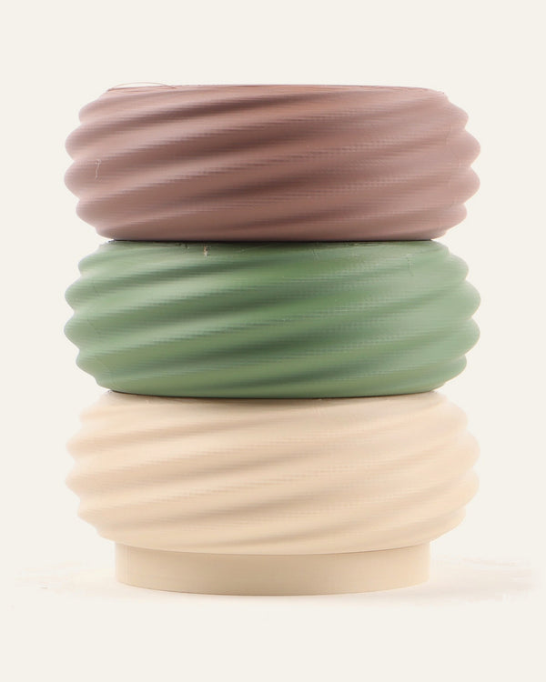 Driftwood, a three-module modular vase in brown, olive green and light khaki